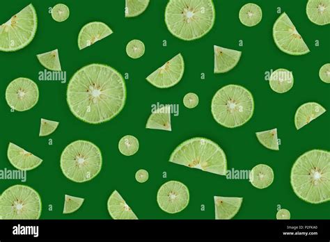 Wallpaper and background of green lemon or lime on the green background ...