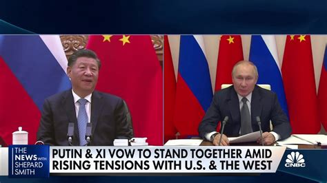 Putin and Xi hold a virtual summit, vow to stand together against West