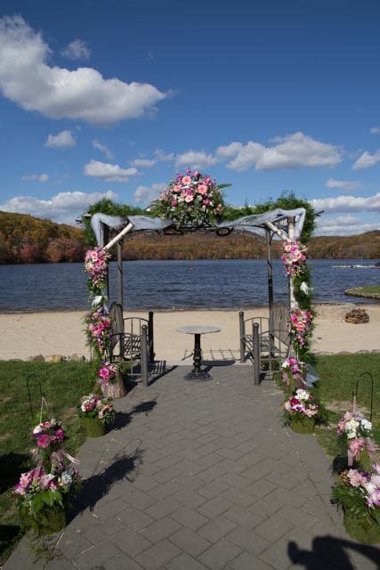 wedding arch on a lake. Perfect fall day. | Wedding arch, Wedding, Autumn day