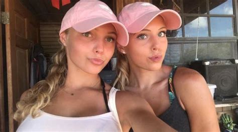 two women in pink hats taking a selfie