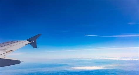 Premium Photo | Blue sky with clouds View out of an airplane window