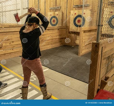 Throwing an Axe editorial stock photo. Image of hatchets - 141423383