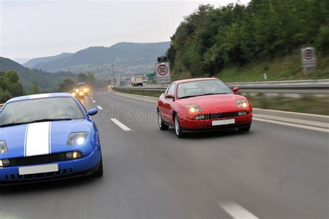 Two Sport Car Racing on the Highway Stock Image - Image of mask, light ...