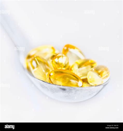 Vitamin E capsules Stock Photo - Alamy