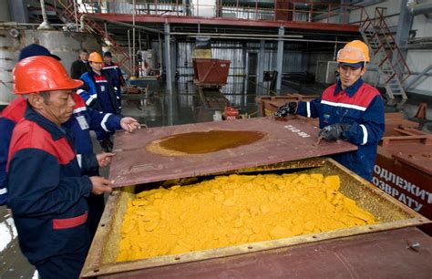 Kazakhstani workers handling Yellowcake Uranium