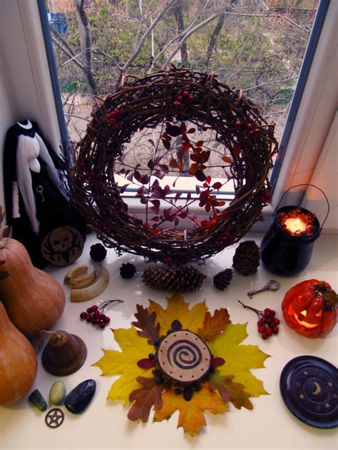 an assortment of autumn decorations on a window sill