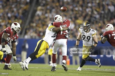 Rear view of Arizona Cardinals QB Kurt Warner in action, making pass ...