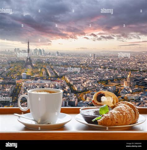 Coffee with croissants against famous Eiffel Tower in Paris, France ...