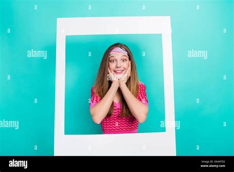 Photo of dreamy school girl dressed pink crop top arms hands cheeks cheekbones photographing ...