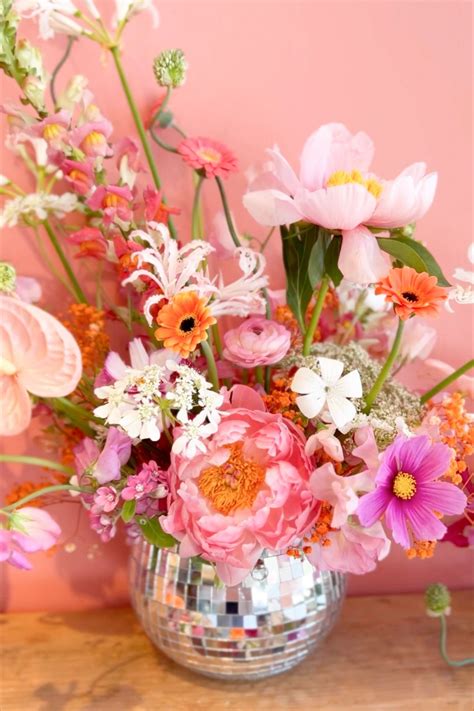 a pink flower arrangement in a disco ball vase Retro Wedding, Wedding ...