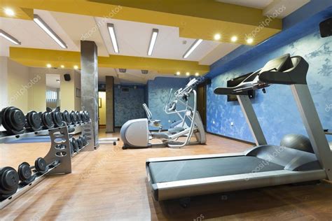 Hotel gym interior with equipment Stock Photo by ©rilueda 100424194