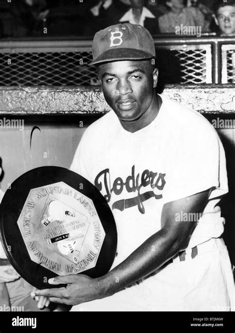 Baseball player Jackie Robinson of the Brooklyn Dodgers holds his MVP award in 1949.Courtesy CSU ...