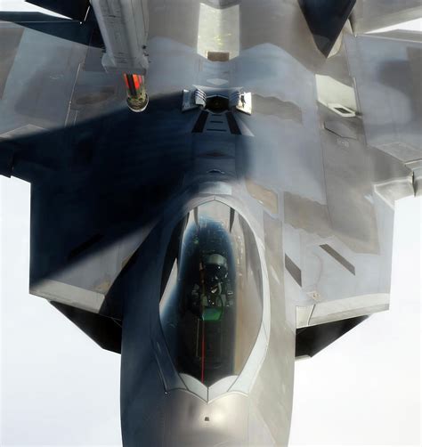 An F-22 Raptor Maneuvers Into Refueling Photograph by Stocktrek Images | Fine Art America