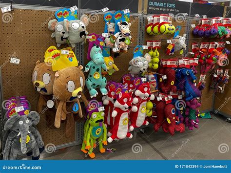 A Display of Various Brands of Colorful Dog Toys for Sale at a Petsmart ...