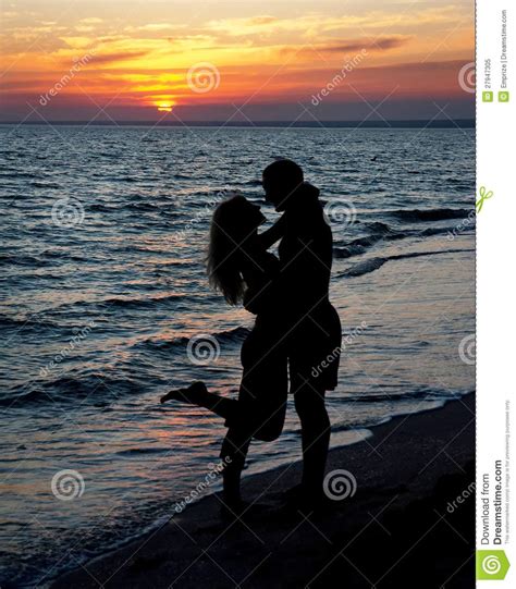 Couple Silhouette on Beach Against Sunset Stock Image - Image of couple ...