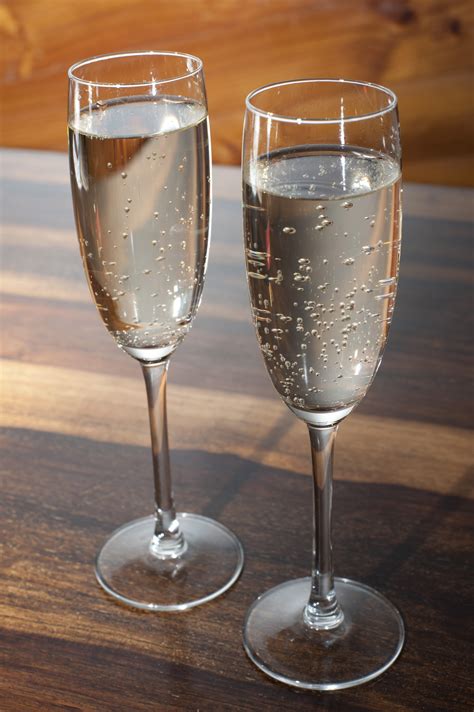Two full flutes of romantic champagne - Free Stock Image