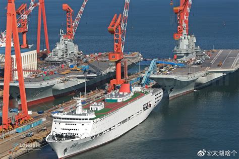 Chinese aircraft carriers Liaoning (Type 001 ,left) & Shandong (Type 002, right) at port. Dalian ...