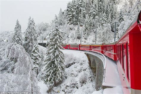 The Bernina Express adds a splash of red to snow-covered Switzerland | Bernina express, Scenic ...