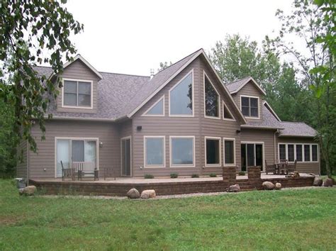 Custom chalet-style modular home with gorgeous windows and patio to enjoy the views. Alpine ...