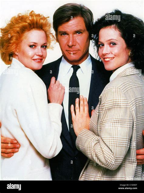 WORKING GIRL 1988 TCF film with from left: Melanie Griffith, Harrison Ford and Sigourney Weaver ...