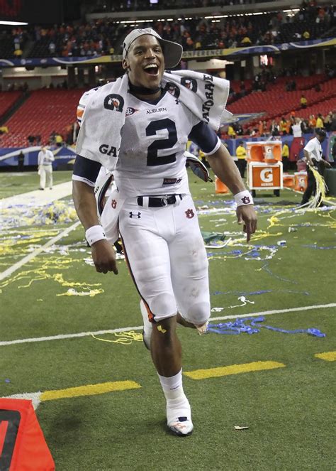 Quarterback Cam Newton #2 of the Auburn Tigers celebrates after the ...