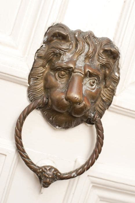 Free Stock Photo 10646 Metal Lion Head Knocker on White Door | freeimageslive