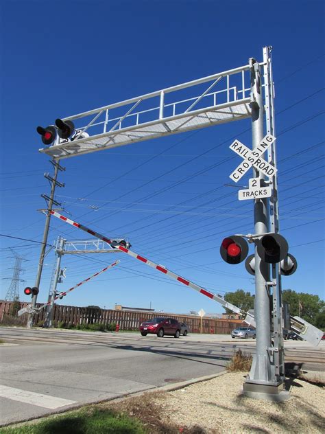 Eddie's Rail Fan Page: The crossing gates rise after a train has passed the Wolf Road railroad ...