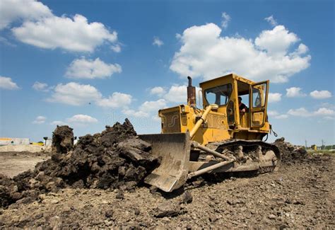 Bulldozer Moving Earth on Sunny Day Stock Image - Image of action ...