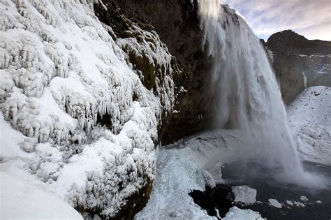 Seljalandsfoss Waterfall in Winter, Iceland | Landscape Stock Photography by Tom Mackie