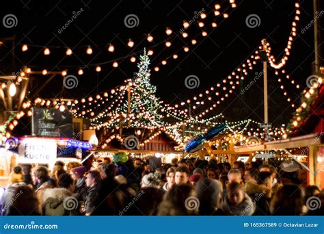 Zurich Christmas Market with Illuminative Decorative Lights at Night Crowd of People and X-mas ...