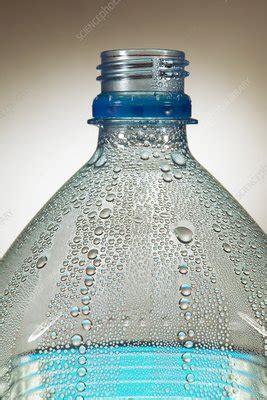 Condensation on water bottle - Stock Image - C018/1182 - Science Photo Library