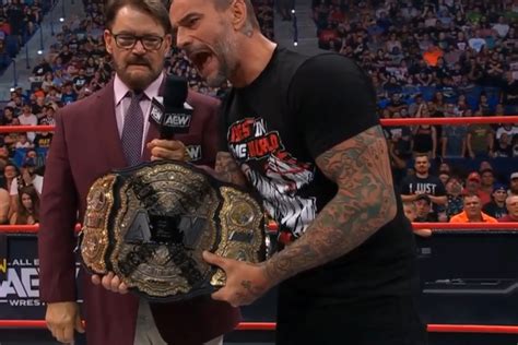 CM Punk Takes His 'Real' AEW World Championship Out Of The Bag, Spray ...