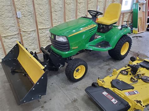 John Deere X585 4x4 Garden Tractor & Attachments - ReGreen Equipment