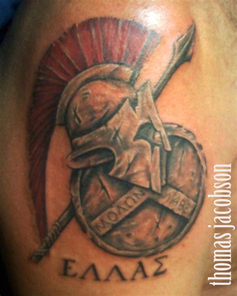 roman shield and helmet tattoo by thomas jacobson | Helmet tattoo, Spartan tattoo, Shoulder ...