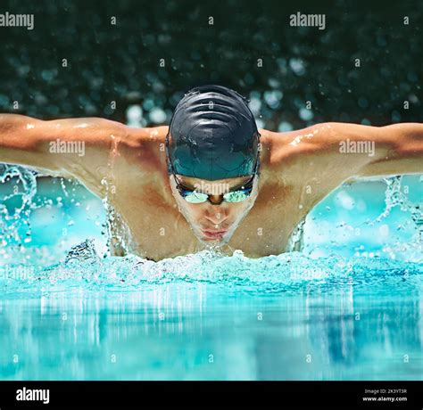 Perfect butterfly stroke. a male swimmer doing the butterfly stroke toward the camera Stock ...