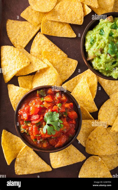 mexican guacamole and salsa dip, nachos tortilla chips Stock Photo - Alamy