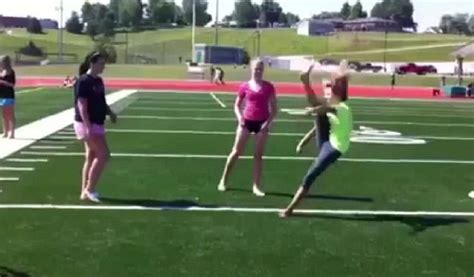 Oops... Cheerleader's knock-out fail as she accidentally kicks herself ...