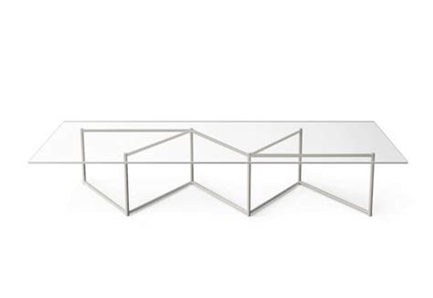 a glass table with three intersecting sections on the top and bottom, against a white background