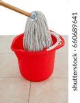 Image of Mopping a tiled white floor | Freebie.Photography