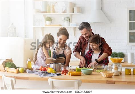 Happy Family Cooking Together On Kitchen Stock Photo 1660483093 ...