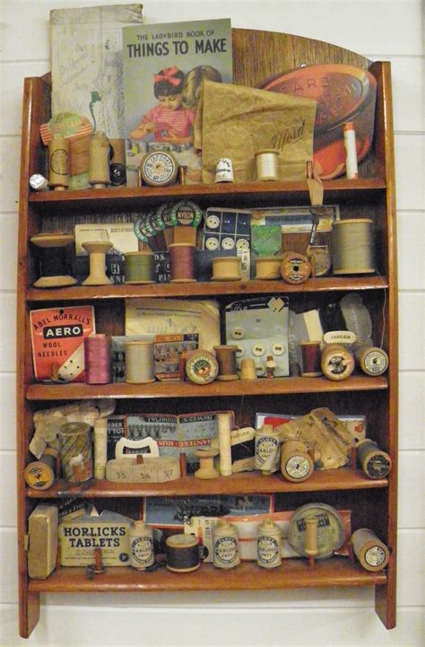 a wooden shelf filled with lots of different types of items on top of each other