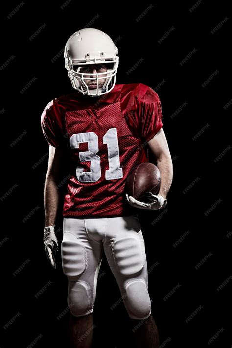 Premium Photo | Football Player with number on a red uniform