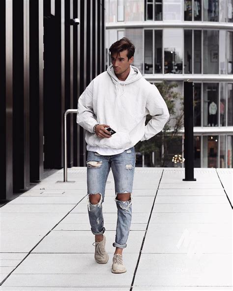 Men's street style. White hoodie sweatshirt + ripped jeans + sneaker. Visit urbanmenoutfits.com ...