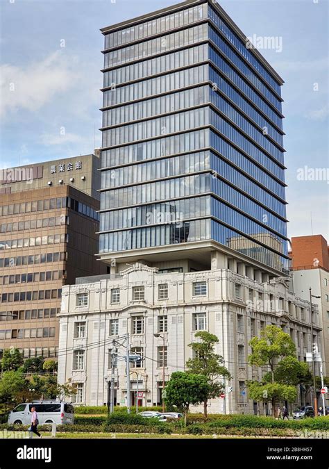 Modern office building on top of old building Stock Photo - Alamy