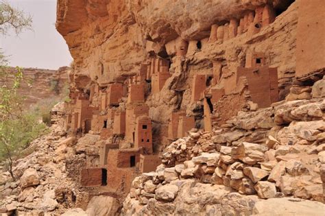 the cliff is made up of clay bricks and mud blocks, with small holes in them