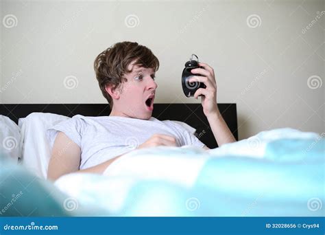 Man Looking At Alarm Clock Late In The Morning Royalty Free Stock Image ...