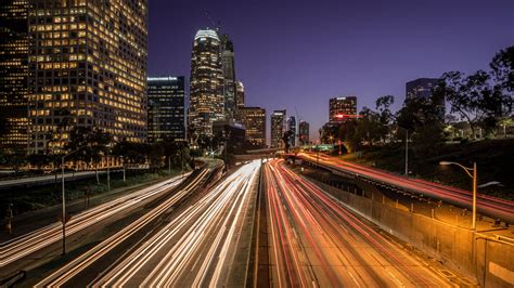 View of buildings with road during night time, highway 110, los angeles ...