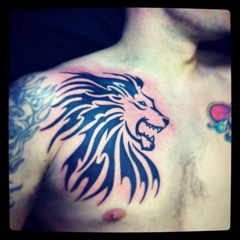 Lion tribal chest tattoo | Tribal chest tattoos, Chest tattoo, Tattoos