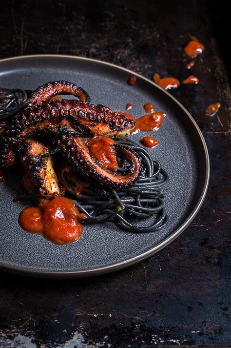 Grilled octopus over squid ink pasta and tomato garlic sauce - Viktoria ...