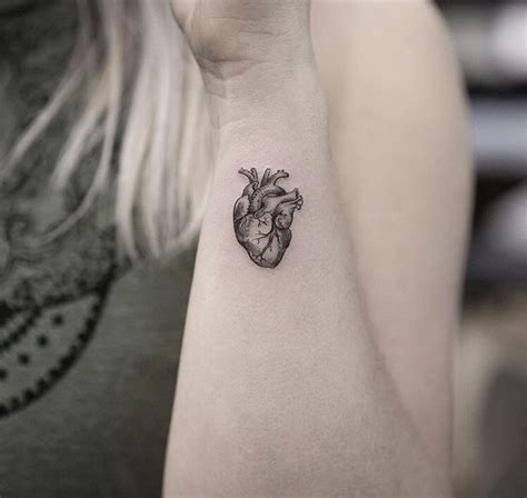 Tiny anatomical heart tattoo on the wrist - Tattoogrid.net